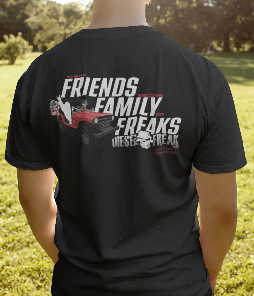 Person wearing a black t-shirt with text and graphics on the back, standing outdoors.